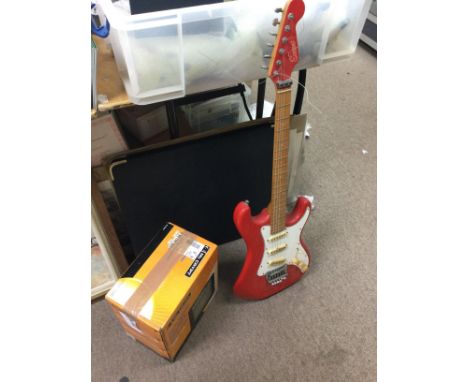 A red encore strat style electric guitar and a boxed Mc Crypt 15 watt practise guitar amplifier. This lot cannot be posted