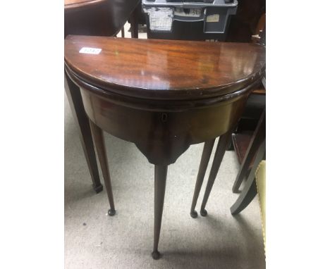 A small Georgian style mahogany Demi loom table the twin flap top above tapering legs . 