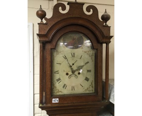 An Early Victorian long case clock eight day going with a painted dial the top arch with Britannia dial with painted inscript