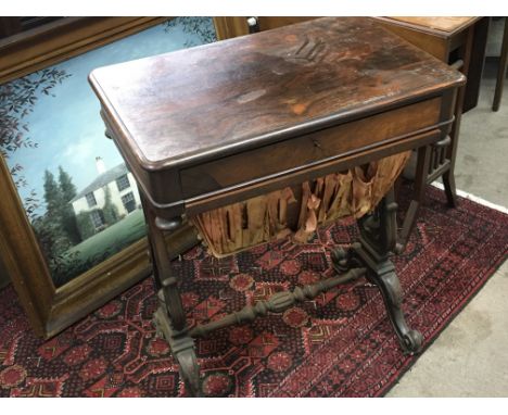 A pen Early Victorian Rosewood work box with a sliding drawer and wool box on harp shaped supports and cabriol legs.