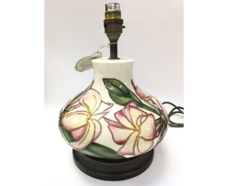 A Moorcroft Frangipani ceramic lamp, this lot cannot be posted. Approximately 28cm tall. NO RESERVE