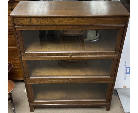 An oak three tier Globe Wernicke style bookcase by Angus , dimensions 31x87x123cm