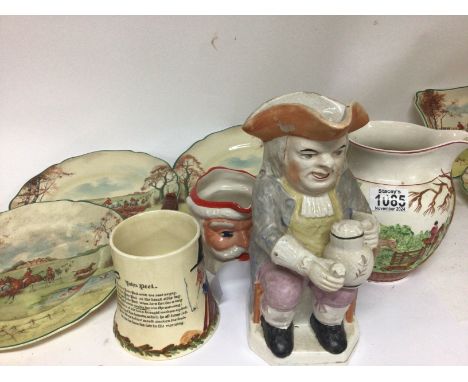 A 19th century ceramic Toby jug a Crown Devon musical jug and six Royal Doulton plates depicting hunting scenes and other cer