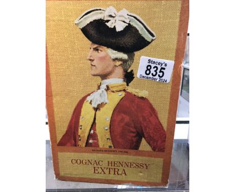 A bottle of cognac Hennessy Extra  .