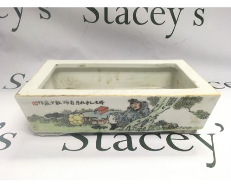 A Chinese rectangular planter with hand painted decoration of figures in a landscape setting with Oriental script, approx len