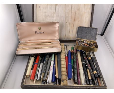 A large collection of various pens to include Parker examples. Shipping category B.