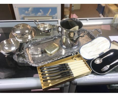 A Collection of silver plate including a tray, dishes, knives and a cased silver hallmarked spoon and fork. Postage category 