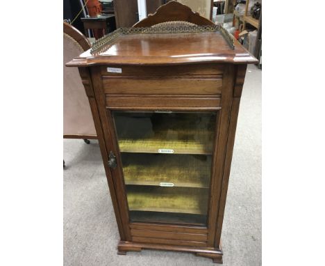 A walnut late Victorian music sheet cabinet the top with a raised three quarter gallery above a well fitted interior. NO RESE