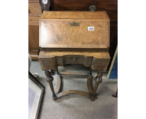 A small walnut bureau.