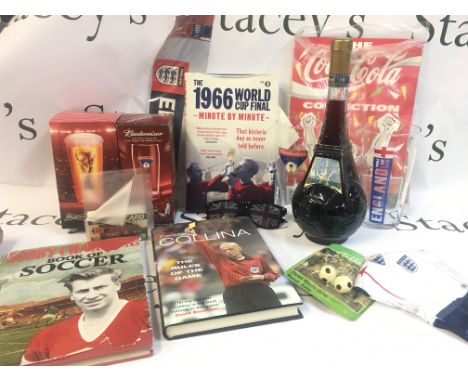 A Collection of various World Cup items including Bobby Charlton book of soccer, boxed beer glasses, Goal 98 bottled by Cevin