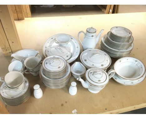 A Noritake dinner set including plates, dishes, cups etc. this lot cannot be posted