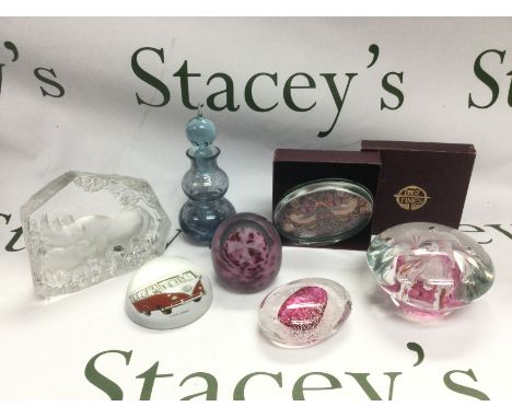 A small collection of glass items comprising mainly paperweights including Goebel and Mdina examples. Shipping category D.