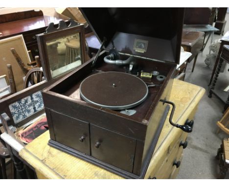 HMV gramophone with needles and a few vinyls. 38cm wide 46 deep and 35 high. Postage D