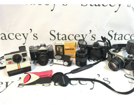 A Collection of vintage cameras Polaroid Land Camera, Zenit-E, Minolta Dynax 7000i, Pentax. Postage category C