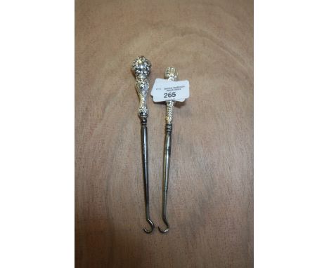 Two silver handled button hooks