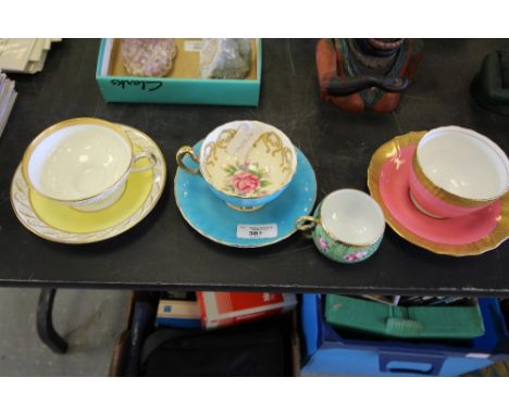 Three mixed cups and saucers and one other