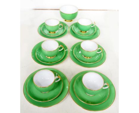 A GROSVENOR CHINA APPLE GREEN GROUND TEA SERVICE, THE RIMS AND HANDLES GILT, PRINTED MARK, 1930S