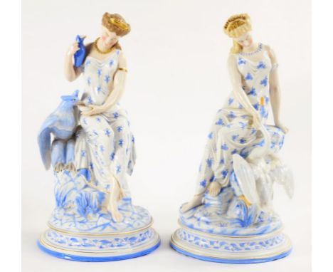 A PAIR OF FRENCH PORCELAIN FIGURES OF SEATED MAIDENS WITH EAGLE OR SWAN, DECORATED IN LIGHT BLUE AND GILT, 38CM H, C1860