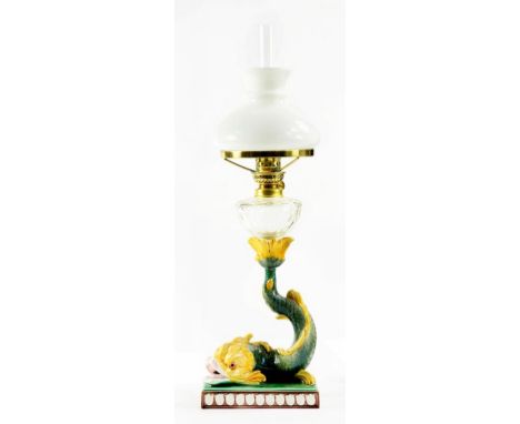 A WEDGWOOD MAJOLICA DOLPHIN CANDLESTICK, ADAPTED AS AN OIL LAMP, 51CM H OVERALL, EXCLUDING CHIMNEY, CANDLESTICK LATE 19TH C
