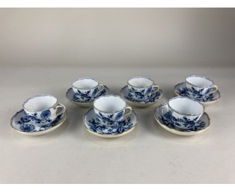 A set of six Meissen porcelain 'onion' pattern blue and white coffee cups and saucers, with floral decoration and gilt embell