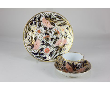 A 19th century porcelain trio of cup, saucer and a plate, possibly Chamberlain's Worcester, with Imari style floral decoratio