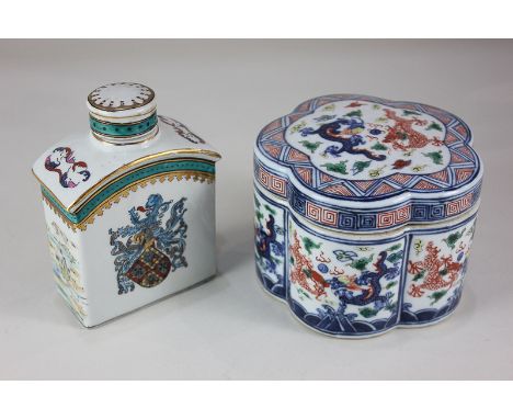 A Japanese porcelain pot and cover, lobed circular form, decorated with dragons in the Imari palette, marks to base, 13.5cm, 