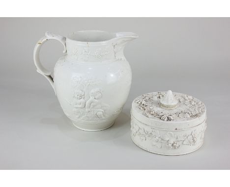A Spode pottery white glazed jug, decorated in light relief with Bacchanalian scenes, 18cm high, together with a Wedgwood whi