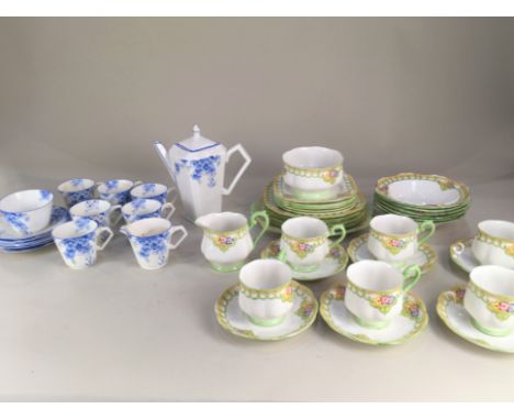 An Art Deco Wellington China coffee set, decorated with forget-me-nots, comprising coffee pot, milk jug, sugar bowl, and six 