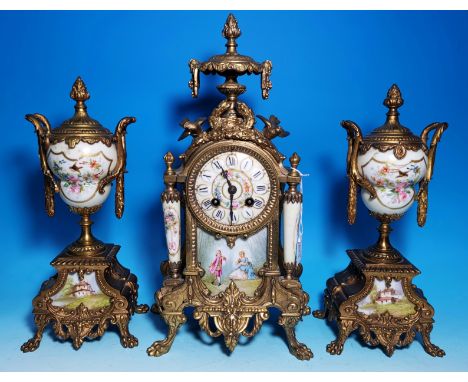 An ornate 19th century Louis XVI style gilt metal and Sevres panel 3 piece clock garniture with vase finial and birds to the 