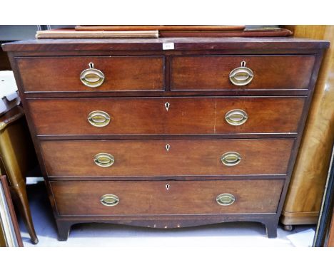 A Georgian mahogany chest of 3 long and 2 short drawers with brass drop handles and bracket feet