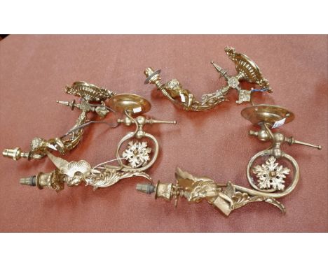 A pair of Edwardian gilt bronze wall light brackets set with female cherubs; a similar pair of wall lights