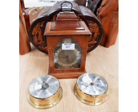 A walnut reproduction Georgian bracket clock; a reproduction ship's clock; a barometer
