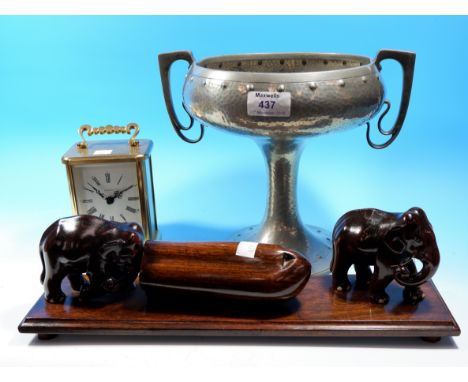 An Art Nouveau pewter pedestal bowl with 2 handles, possibly Liberty's, stamped "English Pewter 6555"; 2 carved Indian figure