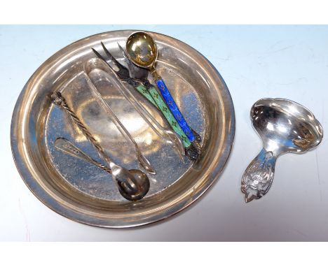 A Scottish silver caddy spoon, Edinburgh 1931; a circular silver coaster, Birmingham 1960; silver sugar tongs, salt and fork,