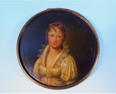 An 18th century circular trinket box, ebonised parcel gilt with hand painted lid depicting head and shoulders of a young girl