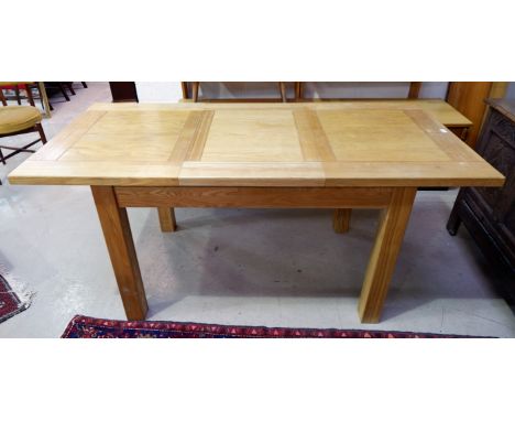 A modern rectangular light oak extending dining table and 2 leather effect chairs