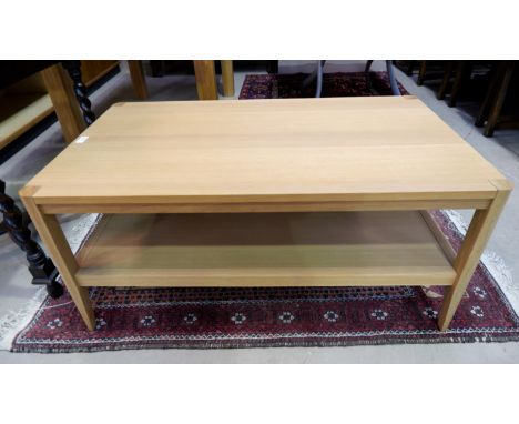 A Marks &amp; Spencer light oak 2 height coffee table with rectangular top