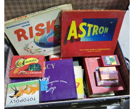 A Waddington's Astron board game; others of the same period in a large travelling trunk