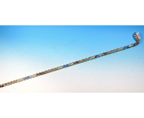 A 19th century novelty twisted glass walking stick filled with 100s &amp; 1000s