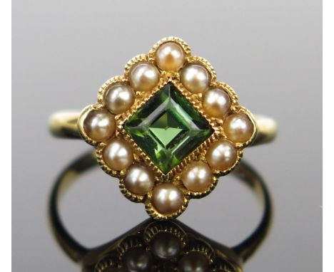 An Antique 18ct Gold, Peridot and pearl (untested) Ring, millegrain set, 11.5mm head, M.25, 2.9g 