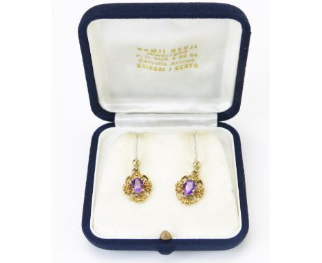 A Pair of 9ct Gold and Amethyst Pendant Earrings, 21mm drop, 3.9g, in Kenya jewellery box 