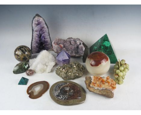 A collection of assorted geological specimens, including a malachite panelled pyramid, an amethyst geode, iron pyrites, vario