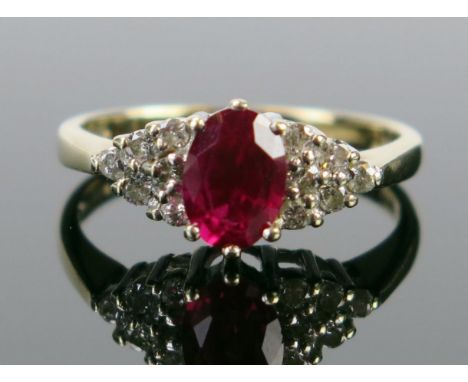 A 9ct Gold, Ruby and Diamond Ring, the c. 7x5mm stone claw set, full London hallmarks, size M, 2.7g 
