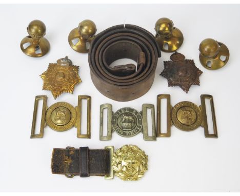 A collection of assorted belt buckles including Royal Marines, Royal Navy, Royal Marine helmet badges, helmet finials leather