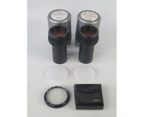 Two Leica Vario_Elmarit-P2 slide projector zoom lens, 1:2,8/70-120mm, in plastic cases, together with a polarising lens. 