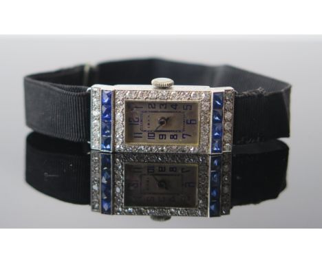 A Ladies IBEX Cocktail Watch in a platinum case set with sapphires and diamonds (31x24.5mm), the rectangular cut sapphires wi