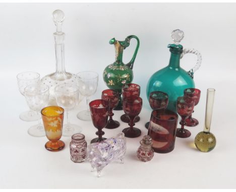 A collection of assorted continental glass wares including ruby glass liqueur tots, etched glass tumblers, ewers and decanter