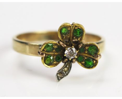 An Antique Diamond and Green Stone Clover Ring in an unmarked gold setting, size R.75, 3.2g 