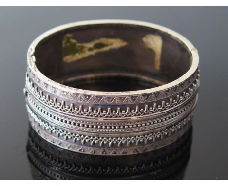 An Unmarked Victorian Silver Hinged Bangle, c. 55x46mm inside diam., 33.3g 