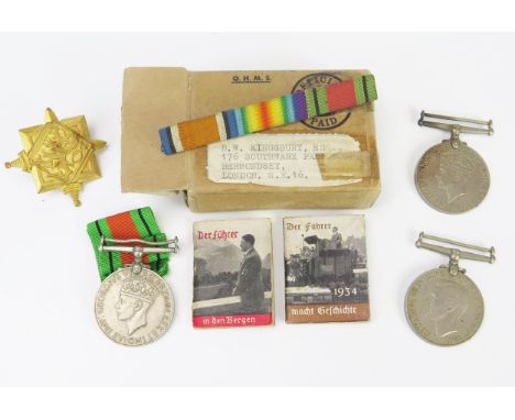 Two World War II War medals, a Defence Medal and two Third Reich propaganda booklets. 